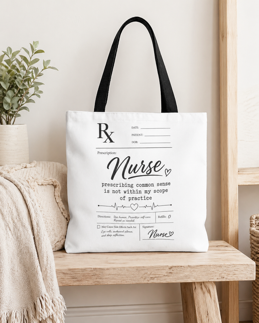 Tote bag with 'Nurse' design on a wooden surface with a plant and blanket in the background black handles