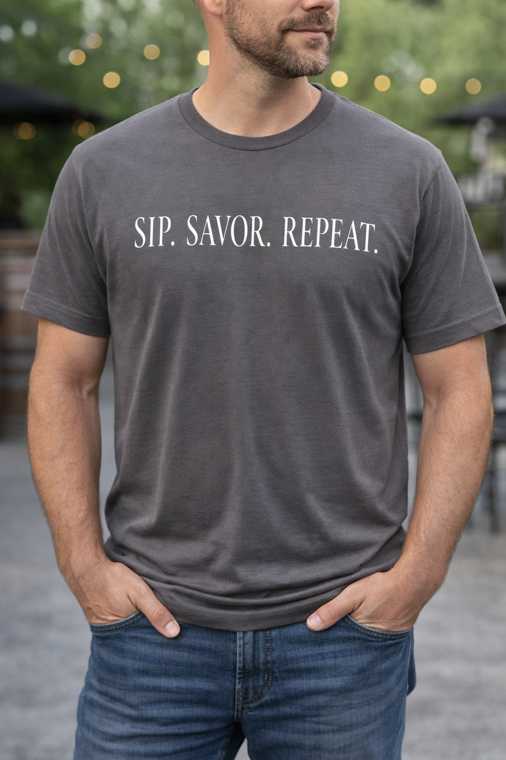 Grey short sleeve cotton shirt with sip. savor. repeat printed on chest.