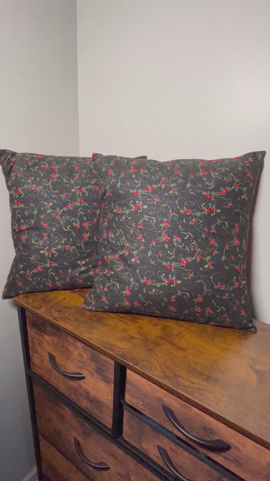 Brief video of 18 inch Christmas holly berry throw pillow with black background and red backing